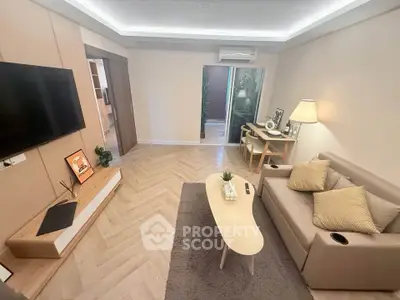 Modern living room with stylish decor, cozy sofa, and elegant lighting in a contemporary apartment.