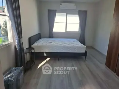 Spacious bedroom with modern design and natural light