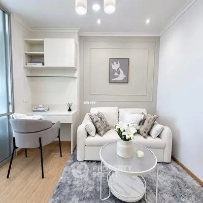 Modern living room with cozy sofa, stylish decor, and elegant lighting in a chic apartment.