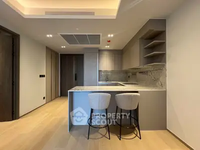 Modern kitchen with sleek design and marble countertops in luxury apartment