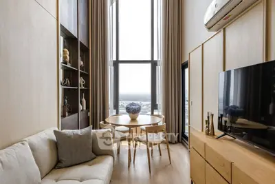 Modern living room with large windows and stylish furniture