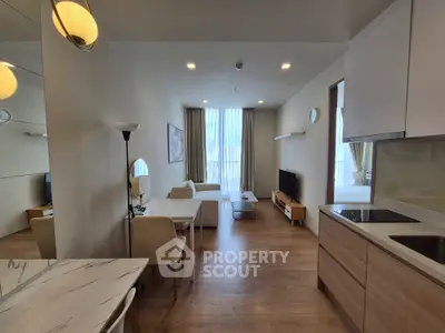 Modern living room with open kitchen and stylish decor