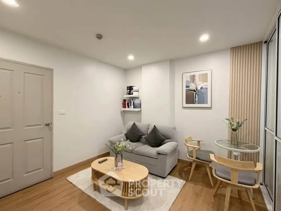 Modern living room with cozy sofa, stylish coffee table, and elegant decor in a bright apartment.