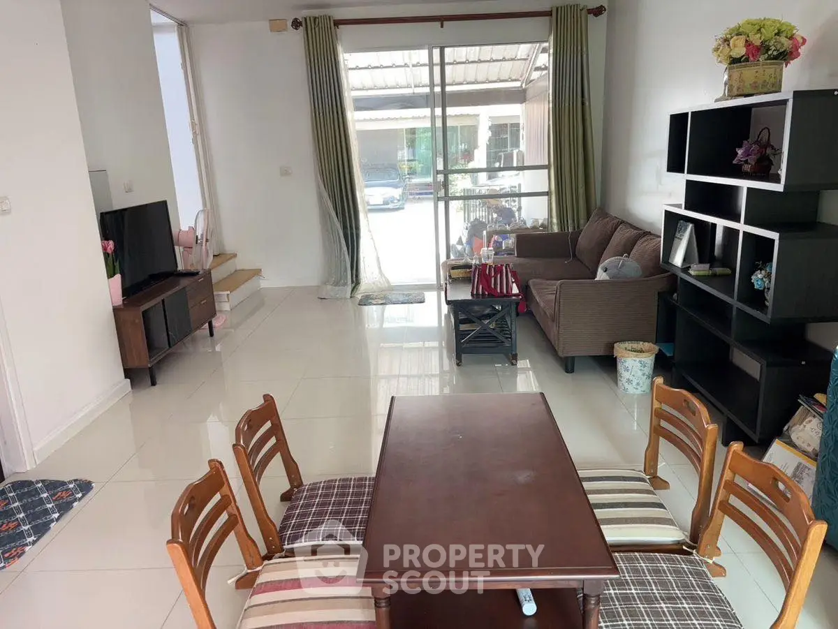 Spacious living room with modern furniture and large windows for natural light.