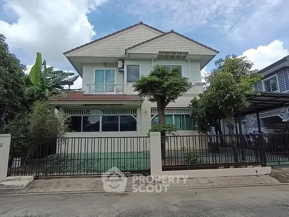 Charming two-story house with lush garden and modern design in a serene neighborhood.