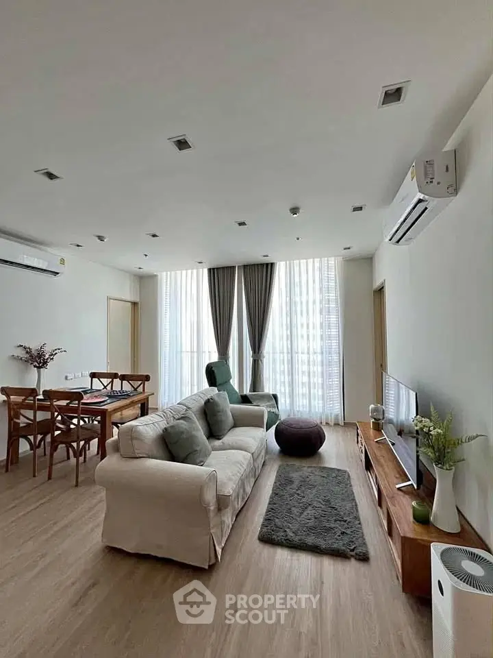Spacious modern living room with elegant decor and natural light