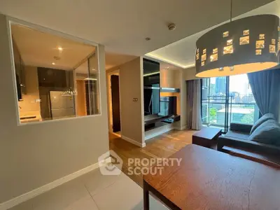 Modern open-plan living room with city view and stylish lighting