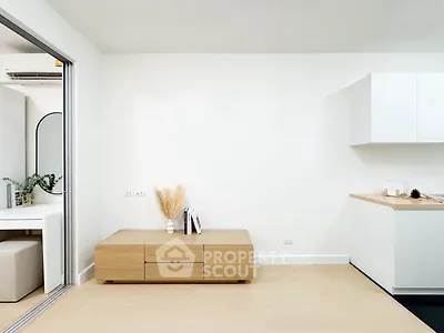 Modern minimalist living space with sleek kitchen and stylish decor
