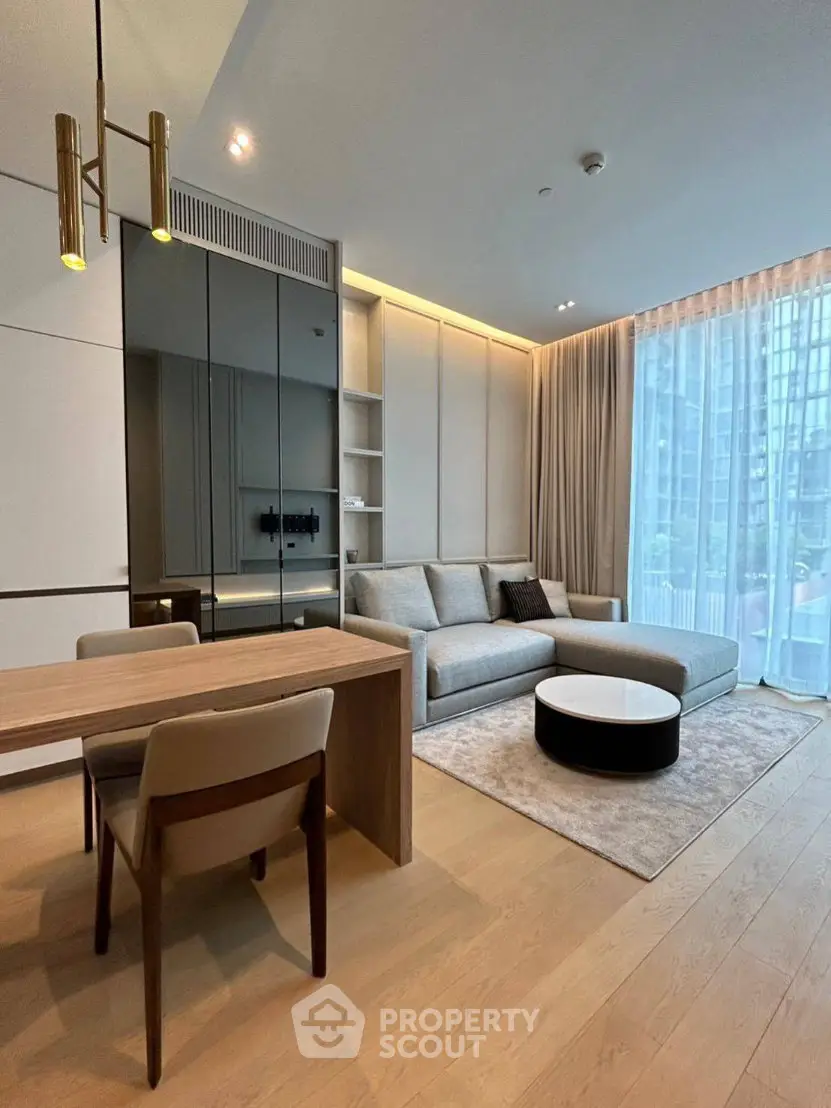 Modern living room with stylish furniture and large window view