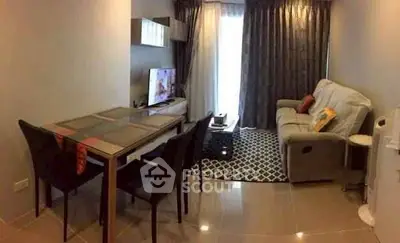 Cozy living room with modern decor and dining area, perfect for relaxation.