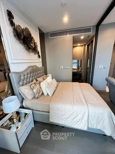 Luxurious modern bedroom with elegant decor and plush bedding