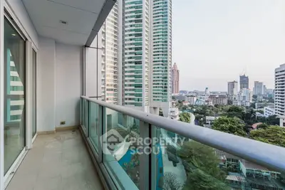 Spacious balcony with stunning cityscape view in high-rise apartment