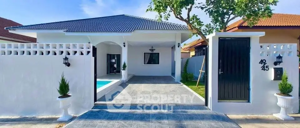 Charming modern house with pool and elegant entrance in serene neighborhood.