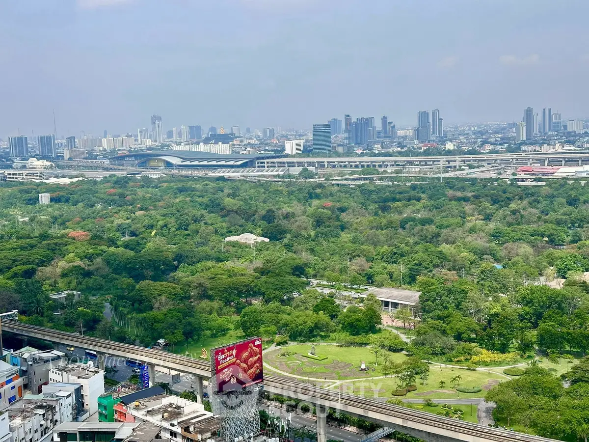 Stunning cityscape view with lush greenery and skyline, perfect for urban living enthusiasts.