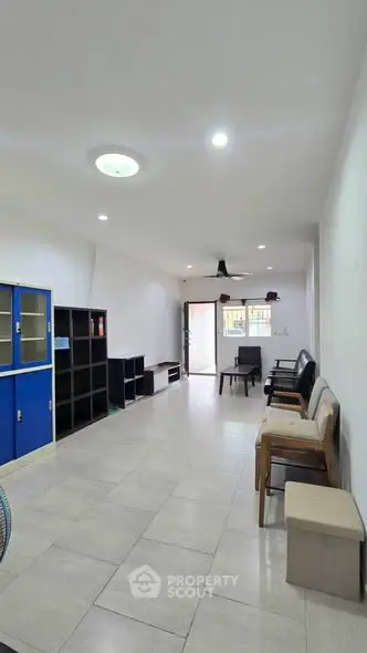 Spacious living room with modern furniture and ample natural light