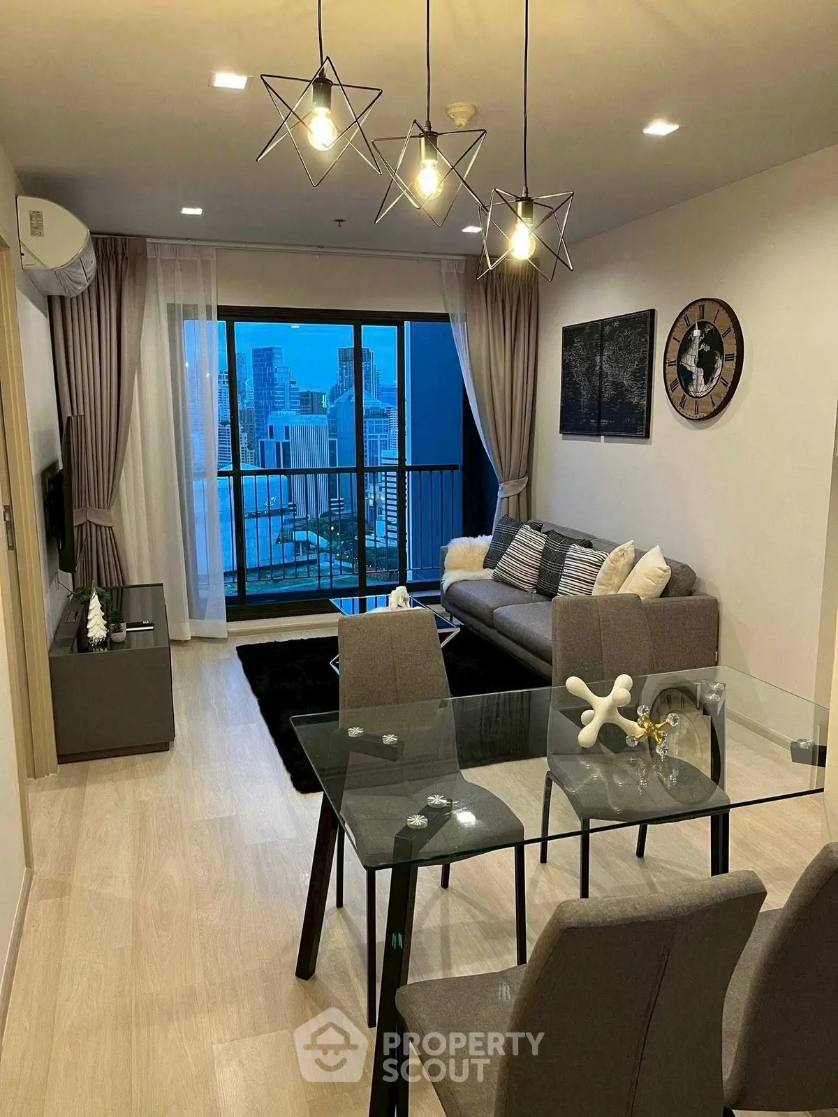 Modern living room with stylish decor and city view balcony