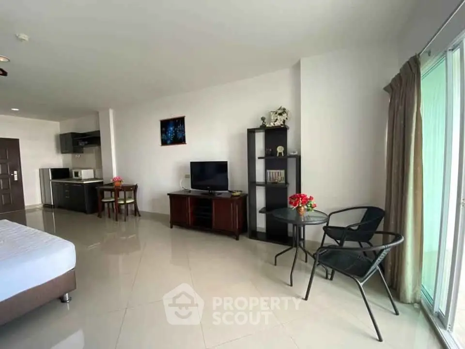 Spacious studio apartment with modern furnishings and natural light