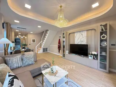 Luxurious living room with elegant chandelier and modern decor