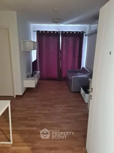 Cozy living room with modern decor and wooden flooring