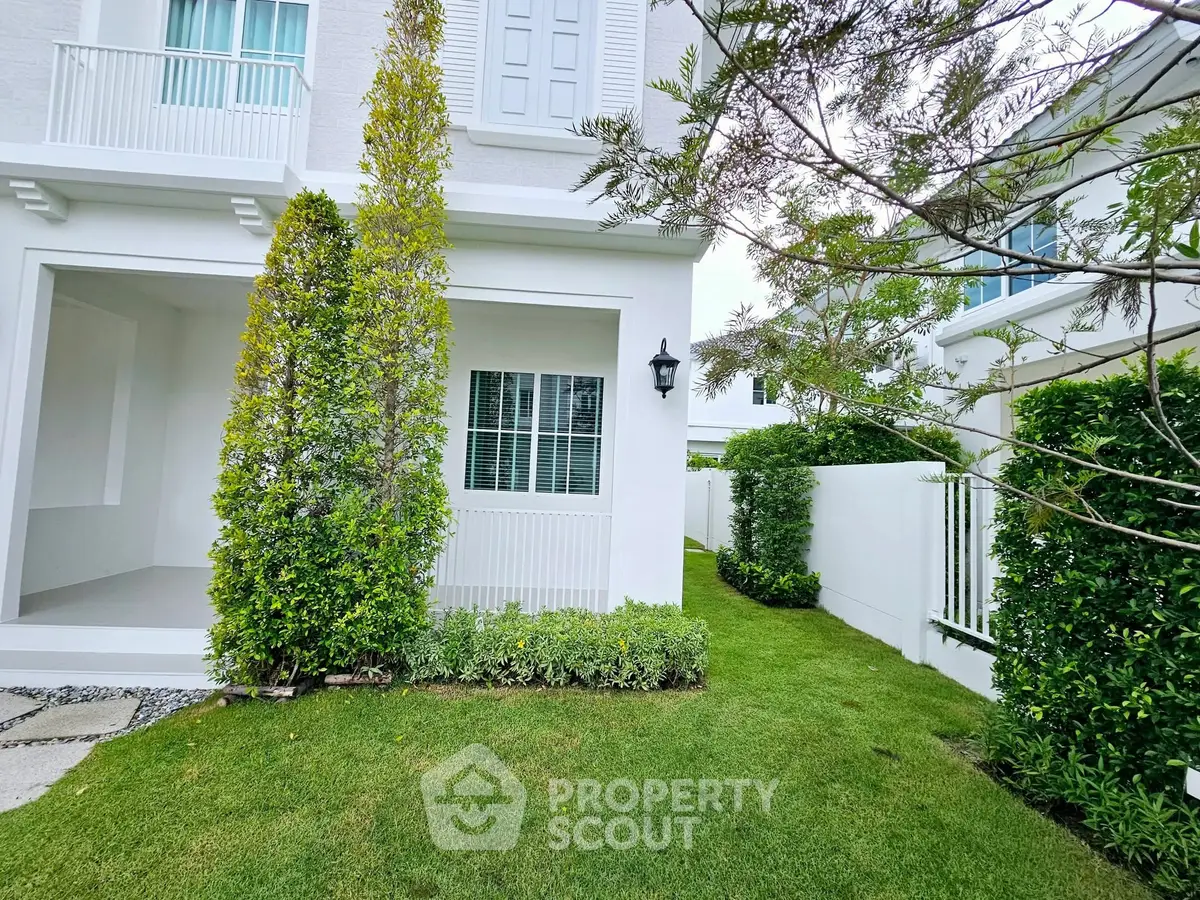 Charming residential garden with lush greenery and modern architecture