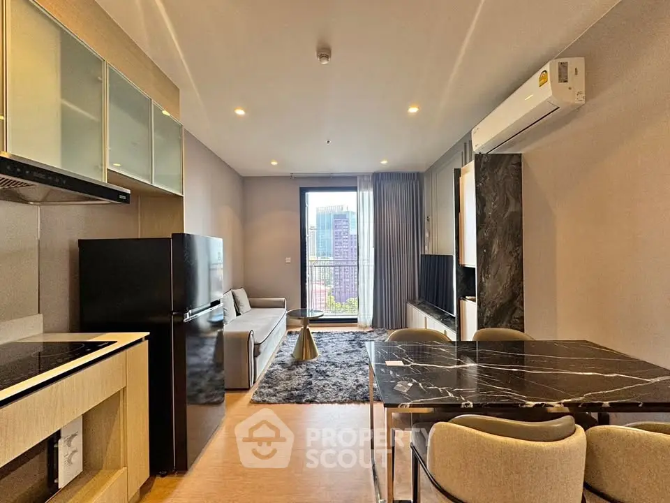 Modern living room with city view, sleek furniture, and open layout.