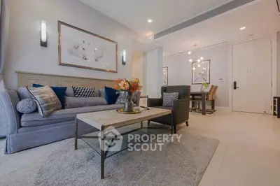 Elegant living room with modern decor and cozy seating area, perfect for relaxation and entertaining.
