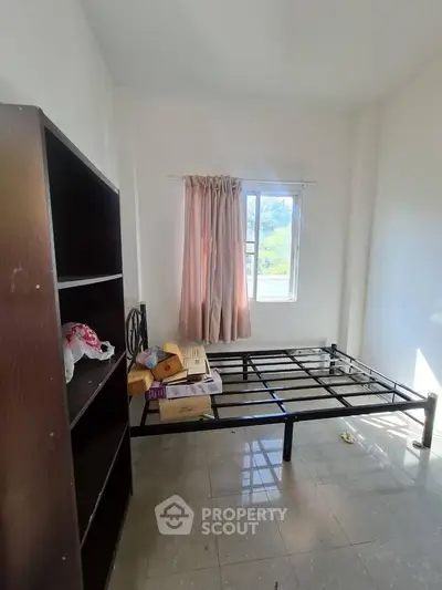 Spacious bedroom with natural light and minimalist design