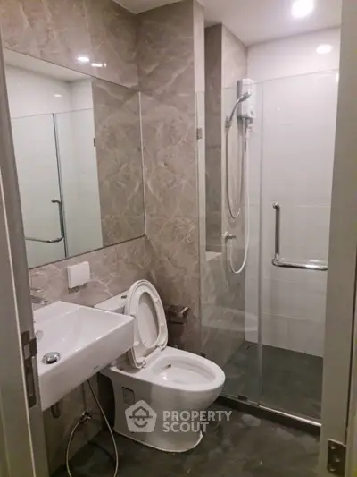 Modern bathroom with glass shower and sleek fixtures