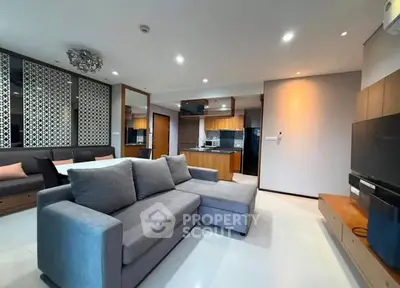 Modern living room with open kitchen and stylish decor