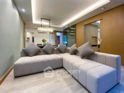 Luxurious modern living room with sleek sectional sofa and elegant lighting