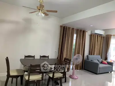 Spacious living room with dining area and modern furnishings