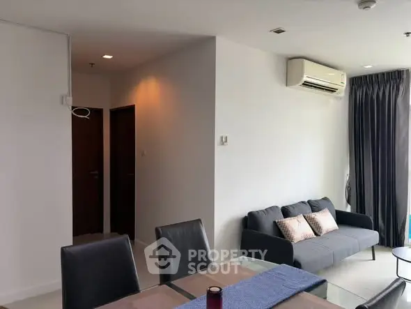 Modern living room with sleek furniture and air conditioning, perfect for comfortable urban living.