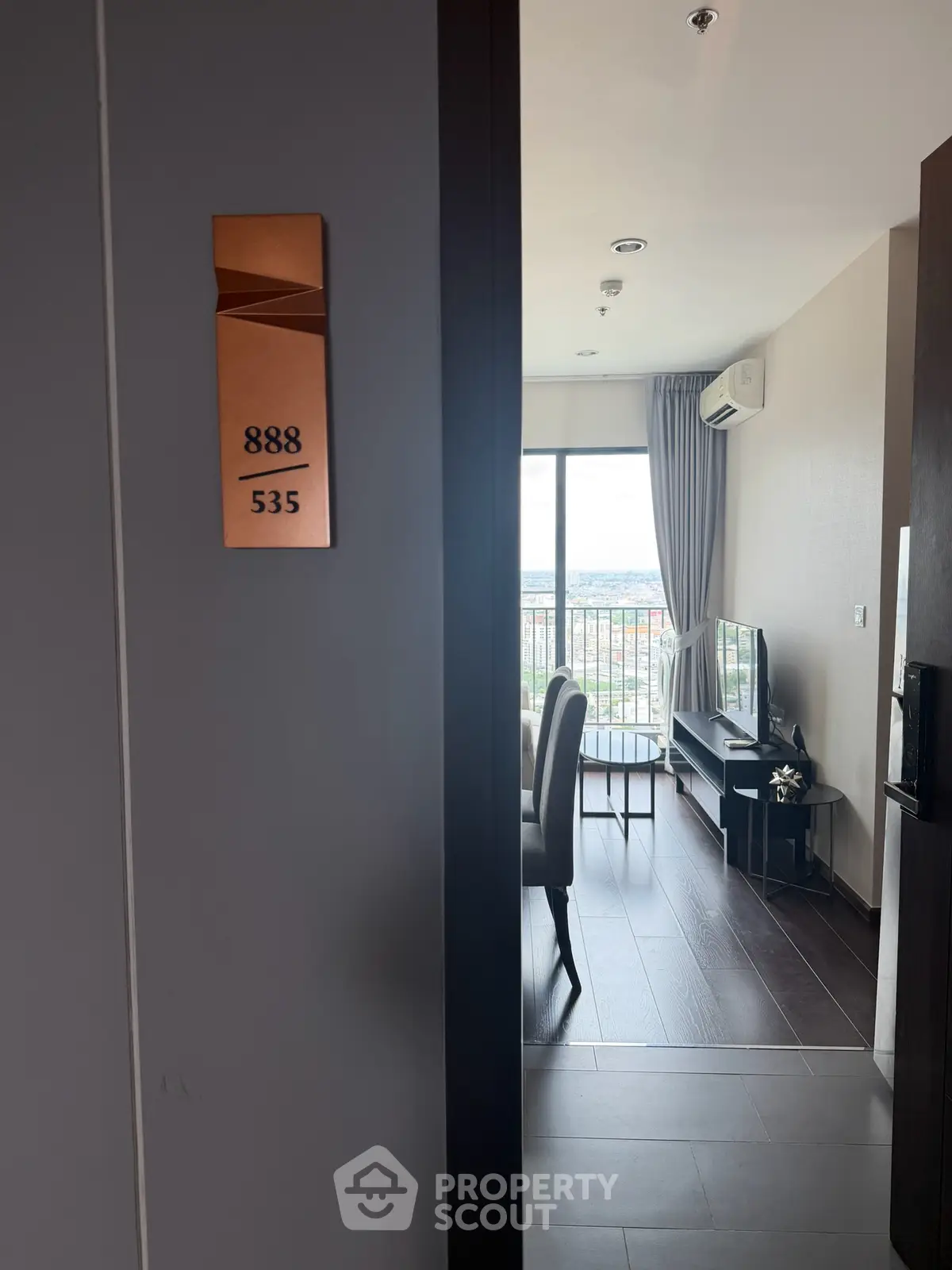 Modern apartment entrance with stylish interior and balcony view