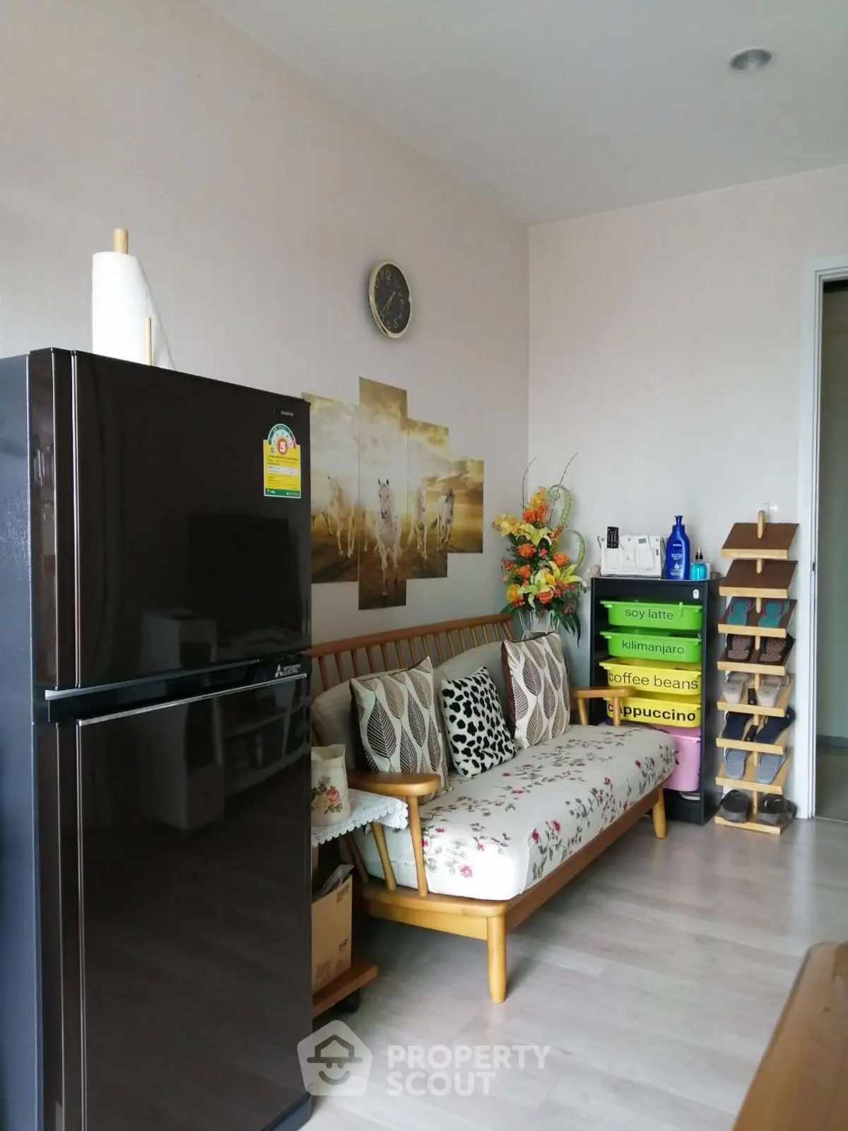 Cozy living area with modern fridge and stylish decor