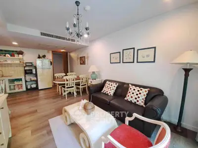 Charming living room with elegant decor and cozy seating in a modern apartment.