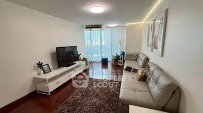 Spacious living room with modern decor and natural light