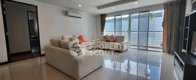 Spacious modern living room with large windows and stylish furniture