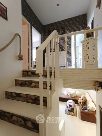 Charming split-level home with rustic brick accents and cozy living area