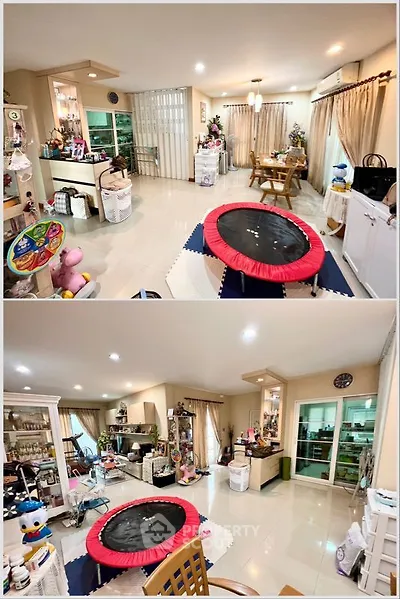 Spacious living room with modern decor and play area, perfect for family gatherings.