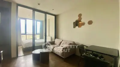 Modern apartment interior with cozy living room and bedroom view