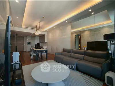 Luxurious modern living room with sleek design and open kitchen layout