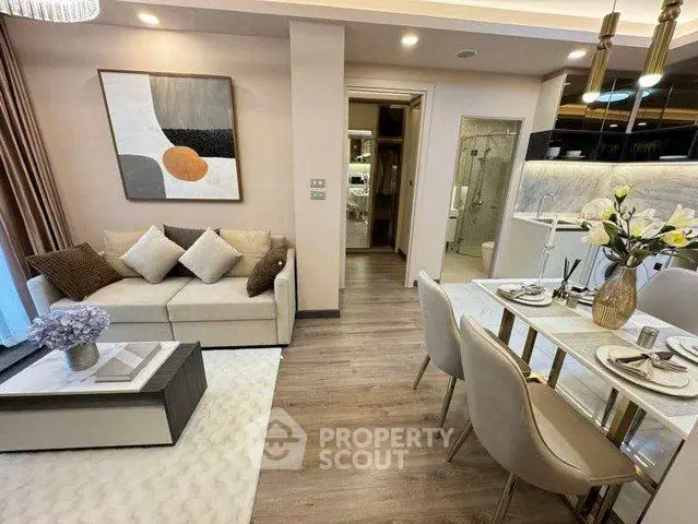 Modern open-plan living and dining area with stylish decor and elegant furnishings.