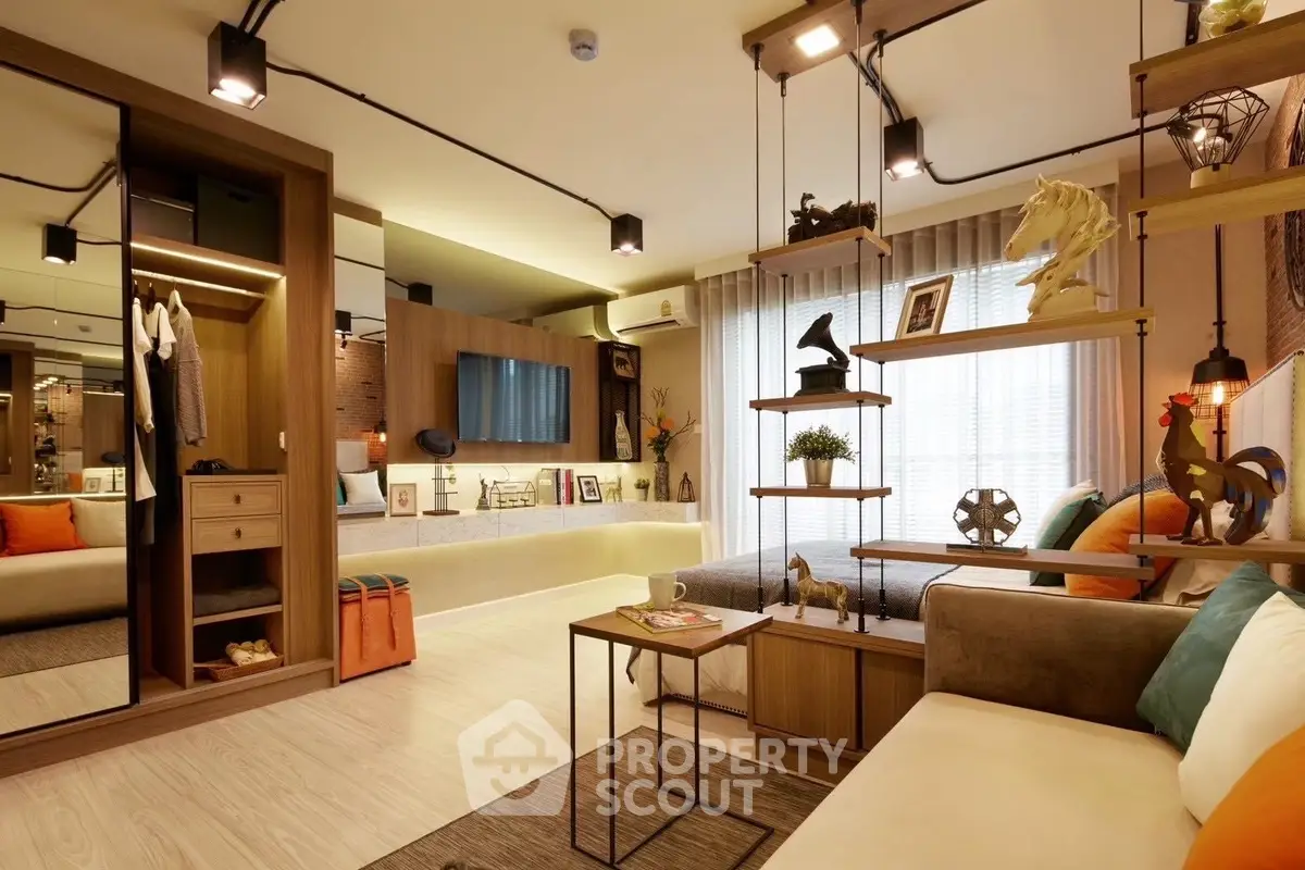 Modern living room with stylish decor and open shelving, featuring cozy seating and warm lighting.