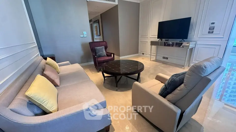 Luxurious living room with elegant furniture and modern decor in high-rise apartment.