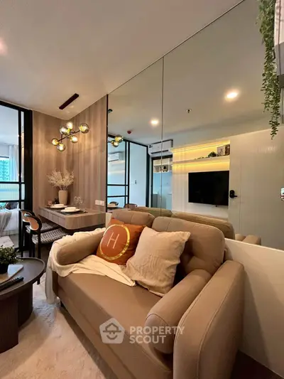 Modern living room with stylish decor and cozy seating in a contemporary apartment.