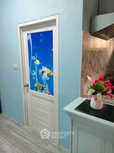 Charming kitchen with unique fish-themed door and modern decor
