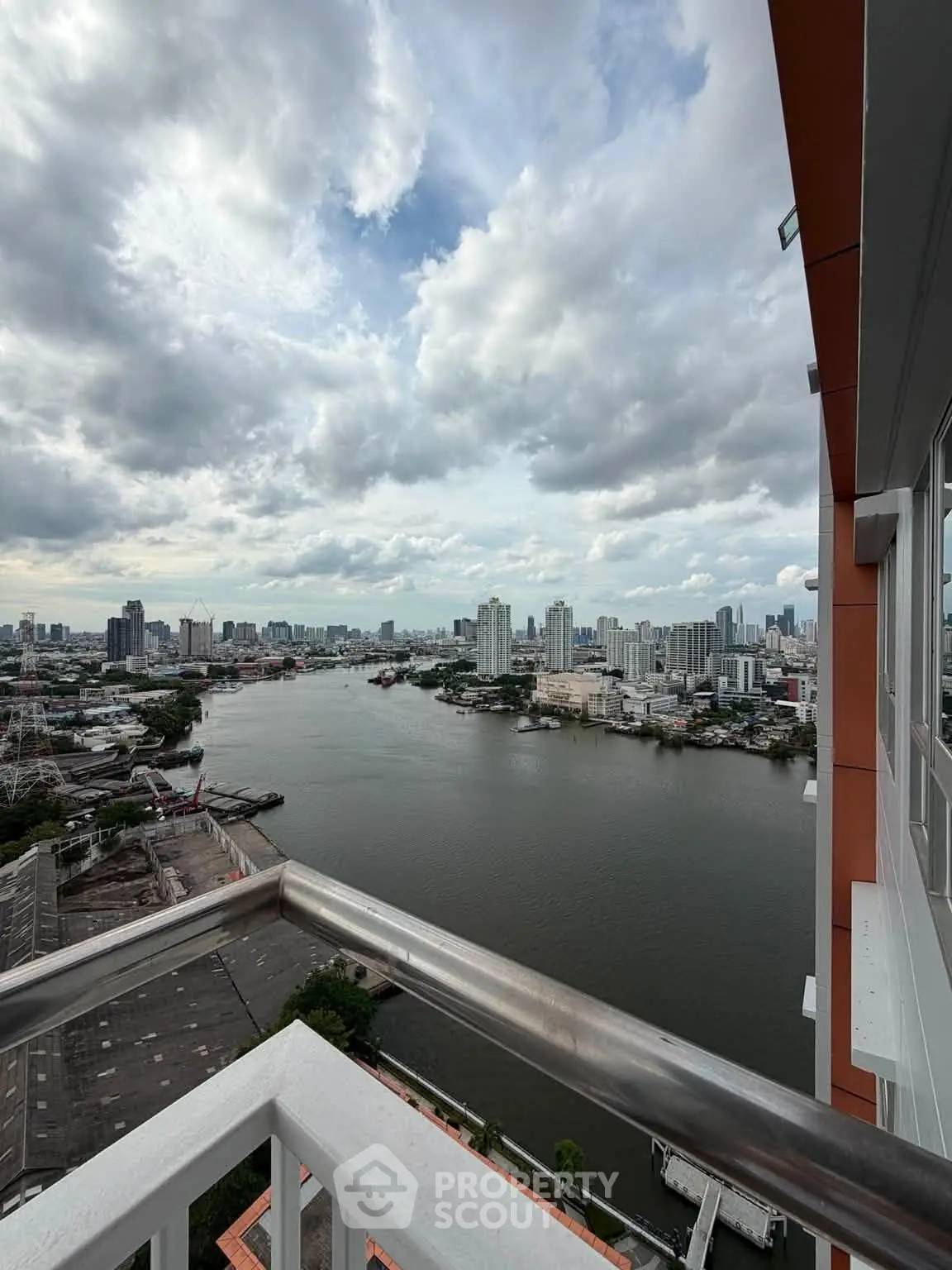 Stunning river view from high-rise balcony with city skyline