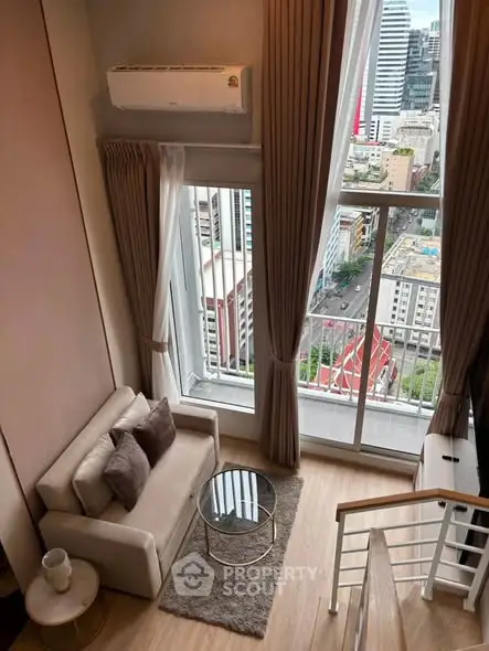 Stunning high-rise living room with floor-to-ceiling windows and city view.