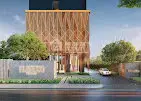 Modern architectural building exterior with lush greenery and sleek design.