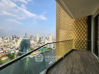 Stunning city and river view from a modern high-rise balcony with unique honeycomb wall design.